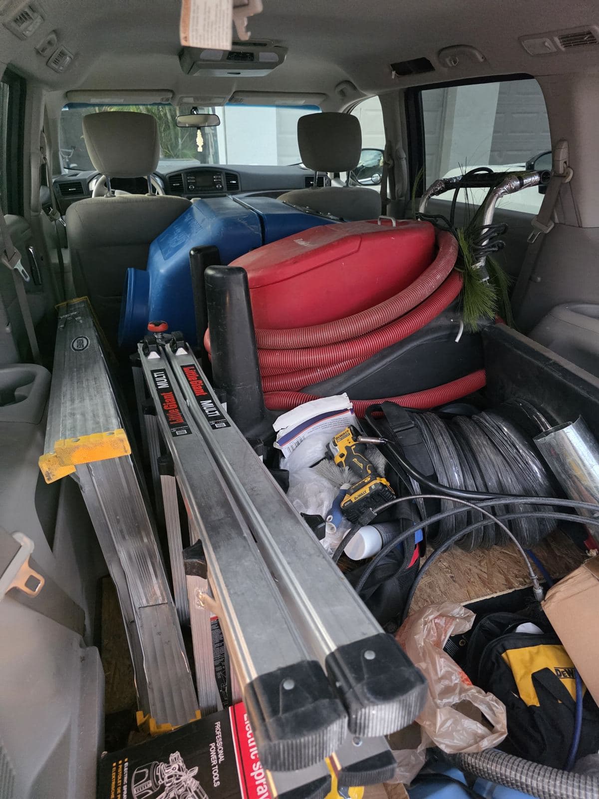 Pure Home Florida van loaded with the blue TurboJet Max negative-air machine, Rotobrush hose, and ladders